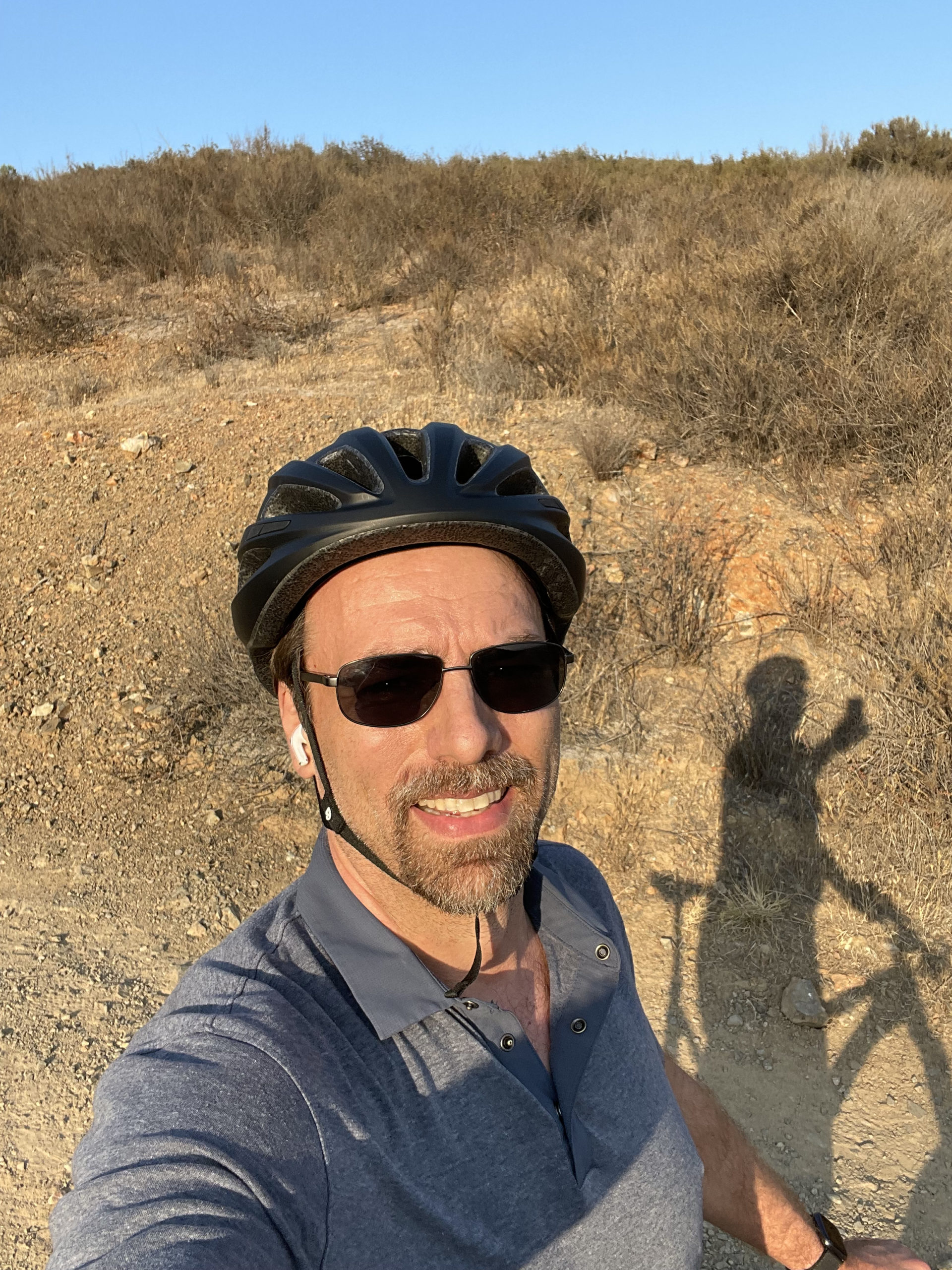 Eric Thiel on a bike on a dirt trail taking time out of his day